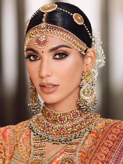 A close-up of the intricate details in a traditional bridal look. My courses cover everything, including how to work with heavy jewelry and headpieces.