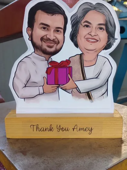 A personalized caricature statue for "Amey." Each one is designed based on photos and can include custom text on the wooden base.