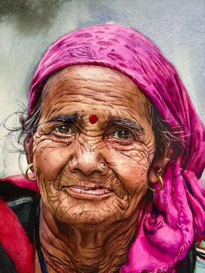 This advance portrait workshop piece is all about color and texture. The vibrant pink of her headscarf contrasts beautifully with the deep, weathered lines of her face, creating a powerful image.