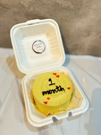 Celebrating one month with this adorable yellow bento cake. It's a sweet and simple way to mark those precious early milestones.