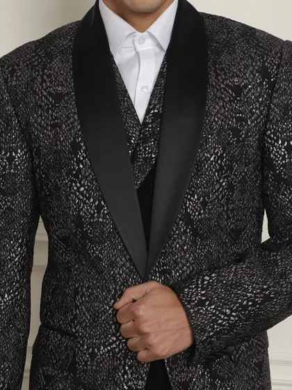 A close-up of the intricate silver pattern on our black tuxedo jacket, showcasing luxury in every thread.