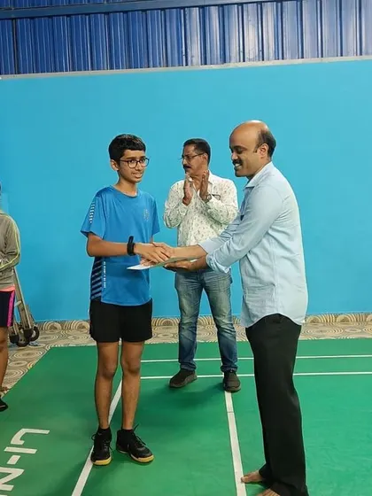 A student receives his award during the prize distribution ceremony of our intra-academy tournament. Every participant's hard work is acknowledged.