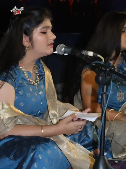 Two of our Hindustani vocal students sing in perfect harmony, a skill honed through dedicated practice in our group classes.