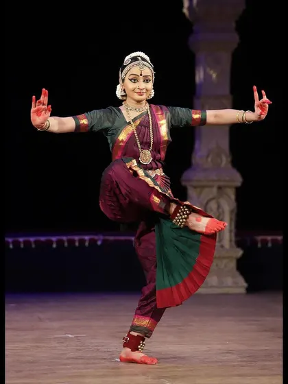 A balanced, one-legged stance that demonstrates both control and aesthetic beauty. This is a moment of stillness amidst the dynamic choreography of "Shivaantarangam."