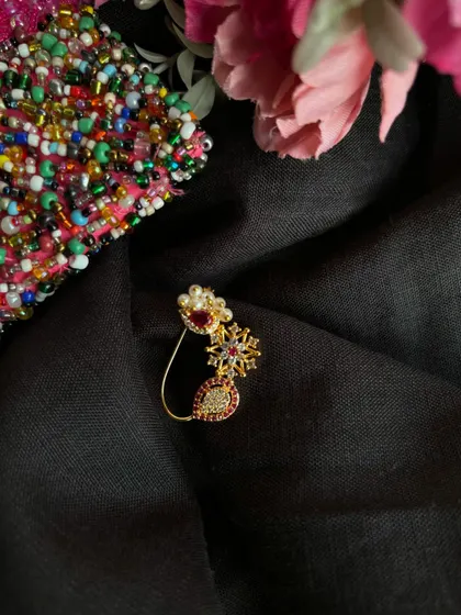 Another view of the American Diamond nath, showing its intricate design.