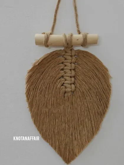 This macrame leaf is made from natural jute-colored cord, giving it a rustic, earthy feel. These are quite popular for bohemian-style home decor.