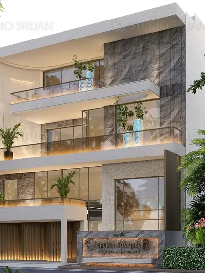 This 400 sq. yard hospital building in Dwarka, New Delhi, was designed with a modern and welcoming facade. The use of natural stone, glass, and integrated planters creates a serene and professional look.