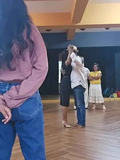 Here I am demonstrating the correct embrace with a student during an introductory workshop. The other students observe, which is a key part of how we learn together as a group.