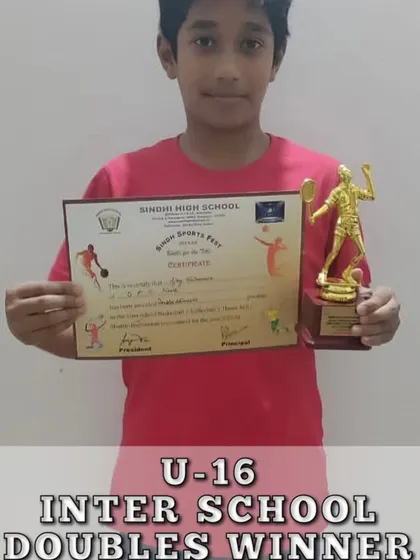 An RBA student celebrating his U-16 Inter-School Doubles win. We encourage participation in school-level sports to build competitive experience.