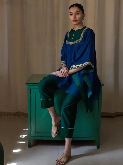 This shot for Bellerobe uses a pop of colour with the green cabinet to complement the royal blue and green of the contemporary kurti set. The composition is balanced and clean, making it ideal for e-commerce and lookbook photography.