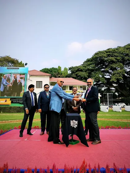 The Leading Owner Cup is presented to the winning connections.