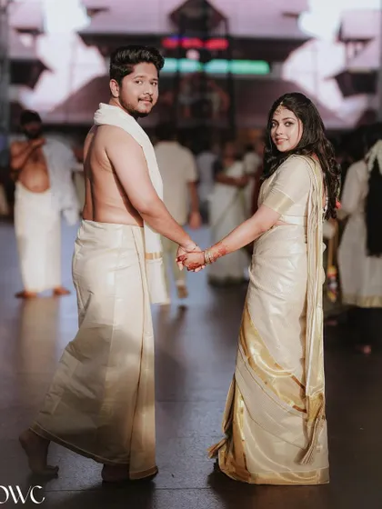 A classic "look back" pose from a newly married couple at their temple wedding.