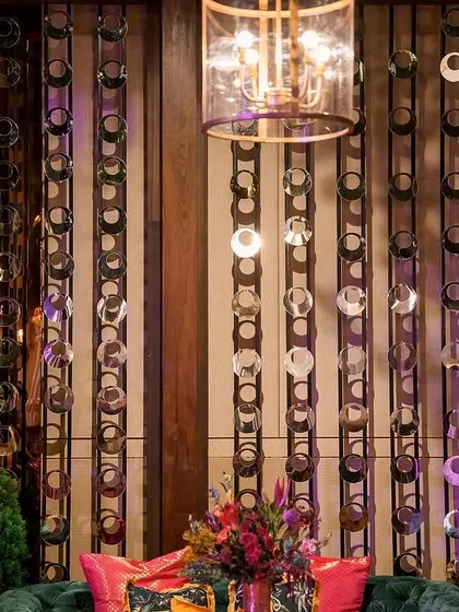 Golden leopard statues stand guard over plush velvet seating at this opulent Sangeet. These bold, thematic details are part of how we bring a client's unique personality and vision to life.