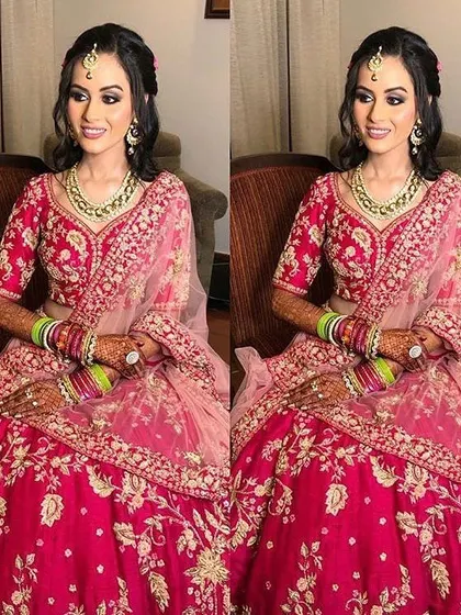 A radiant bride ready for her big day in a beautiful pink lehenga. I created a soft, glowing look with defined eyes and a matching pink lip, paired with a simple maang tikka and elegant hairstyle.