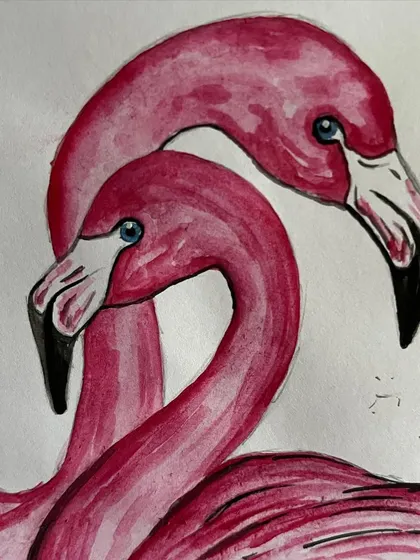 A close-up of the flamingo watercolor painting, showing the delicate brushstrokes on the feathers.