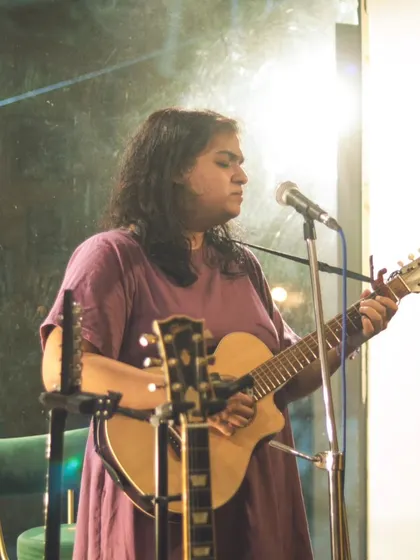 A singer-songwriter sharing her craft with an attentive audience. Our space is a sanctuary for original music and creative expression.