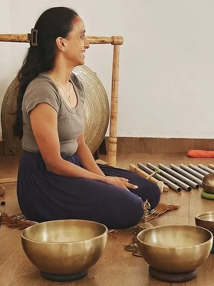 A graduate of my program, surrounded by the instruments she uses to conduct her own sessions. Seeing my students thrive is the greatest reward of my work.