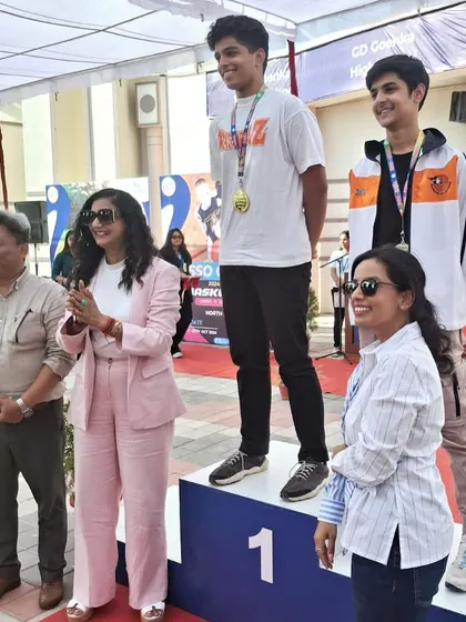 Neil Jain stands proudly on the first place podium after his Gold Medal win at the All India ISSO Shooting Championships.