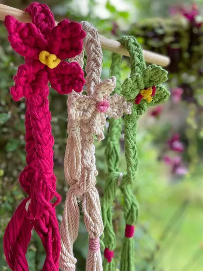A trio of my flowery bandana bands hanging together. I can customize these in many different colors, from bright pink and green to a soft, natural off-white.