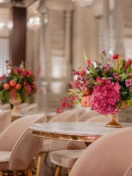 The only theme we recommend is "Keep it Classic." This photo from a Muhurtham shows how timeless decor, like these elegant seating arrangements and lush floral centerpieces, creates a breathtakingly beautiful atmosphere.