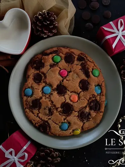 This custom cookie is as big as your face and perfect for Christmas gifting. You can choose your own toppings, like these colourful gems and dark chocolate chips.