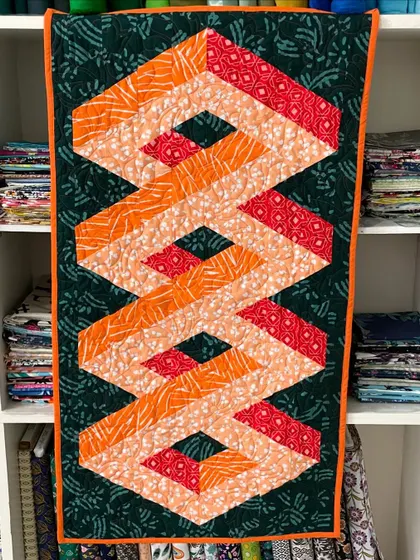 A straight-on view of the 3D quilt, perfect as a modern wall hanging.