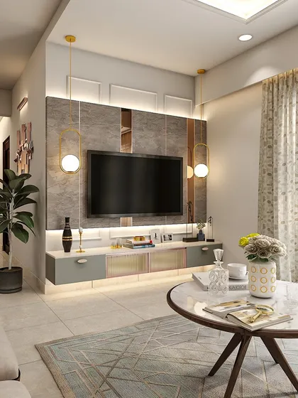 This living room features a stylish TV unit with a grey stone-finish panel and integrated lighting. The round marble coffee table adds a touch of modern elegance.