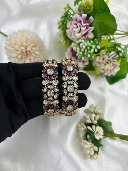 A close-up of the Gulzar Mina Kari Moissanite Kundan Bangles. This image highlights the rich ruby-colored Meenakari and floral design.