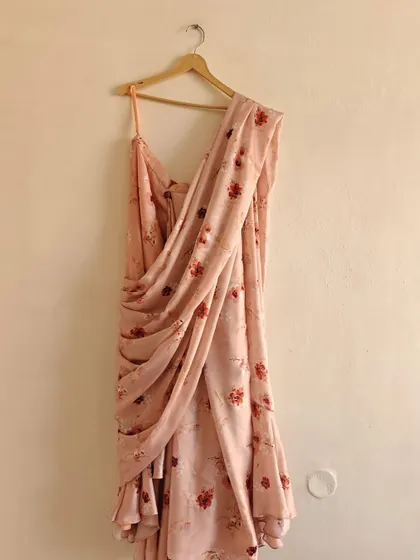 New in our collection, a pretty peach floral pre-draped saree, perfect for a summer day event.