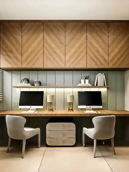 A sleek and symmetrical home office for two, featuring chevron-patterned wood cabinets and a long, shared desk.