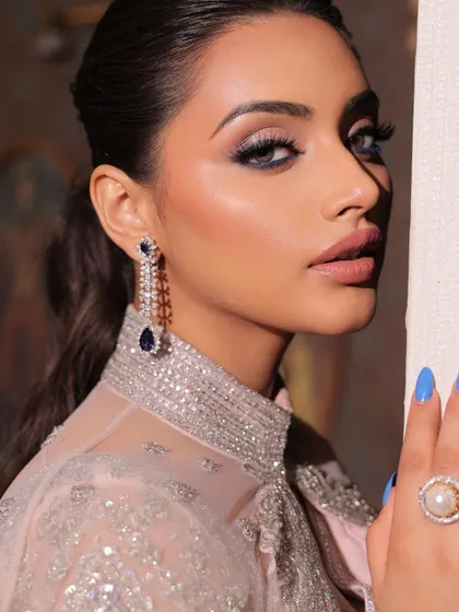 A duplicate of 90, this image shows a vision of elegance in a modern saree. This look features bold, smokey eyes and mesmerizing lips, a perfect combination for a cocktail party.