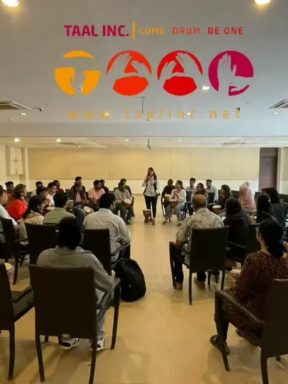 This image perfectly illustrates the recipe for a successful session. With a clear objective and an expert facilitator, a group of individuals quickly transforms into a cohesive, rhythmic team.