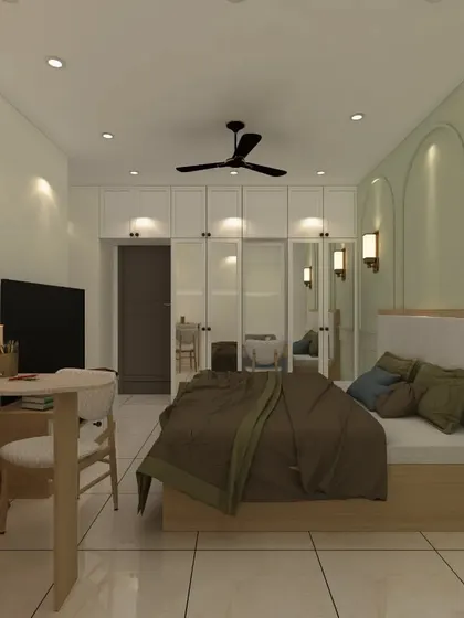 A serene guest bedroom with a simple, clean design. The room features a full-wall mirrored wardrobe that visually doubles the space, and a soft green accent wall for a touch of color.