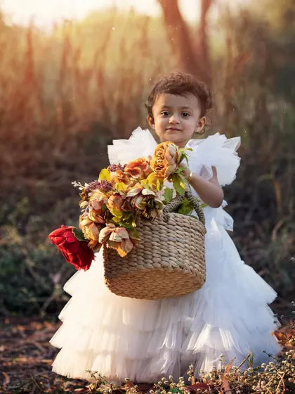 This little lady with her basket of flowers is just the sweetest thing. Outdoor photoshoots allow kids to be themselves and explore, resulting in beautiful, natural portraits filled with personality.