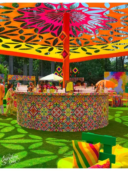 This circular bar was the centerpiece for a vibrant Holi festival. The intricate patterns, custom canopy, and explosive colors show how I can build a high-energy, branded experience for large-scale outdoor events.
