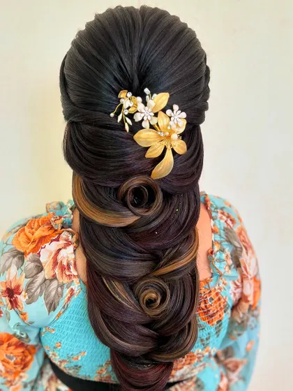 The full view of this stunningly creative braid. The highlights in the hair accentuate the beautiful patterns, making it a true work of art.