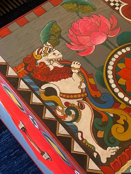 A crisp, detailed shot of the hand-painted Yali figure. This mythical creature, part lion, part elephant, is a powerful symbol that I love to incorporate into my restoration work.