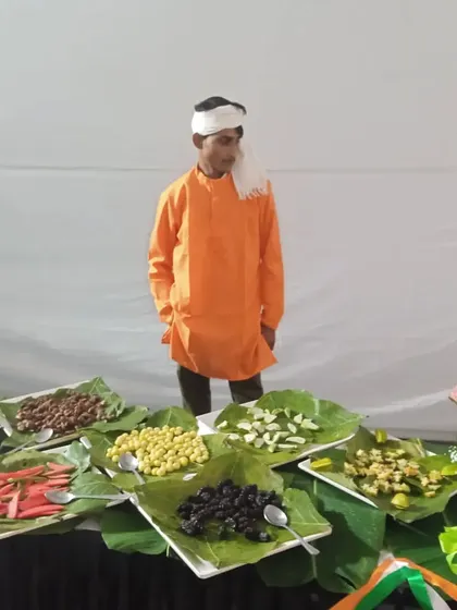A traditional Indian salad counter featuring various beans, sprouts, and vegetables served on fresh leaves.