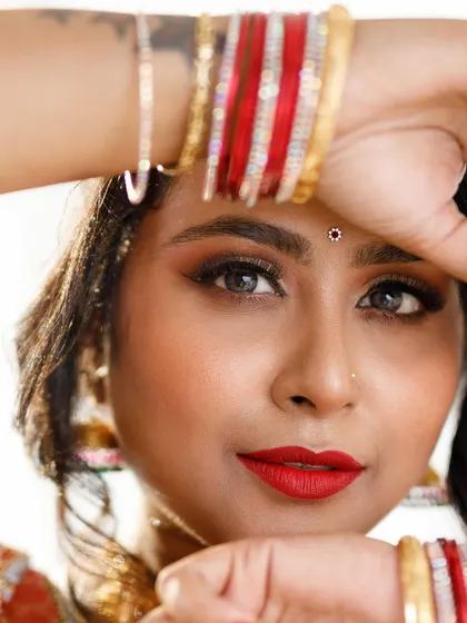 An intense and captivating close-up. This shot focuses on the dramatic eye makeup and the model's direct gaze, showing how makeup can be used to create a powerful mood.