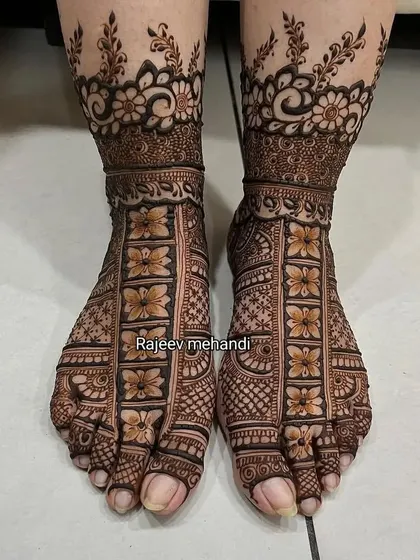 A beautiful floral foot mehendi design, with a net of flowers covering the feet and a floral band at the ankles.