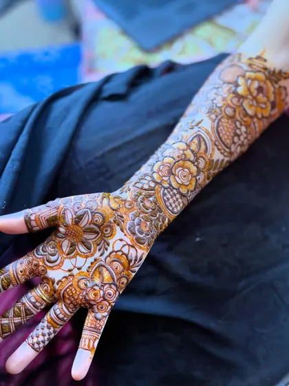 A single arm view of the signature floral design, showing the beautiful flow of the pattern.
