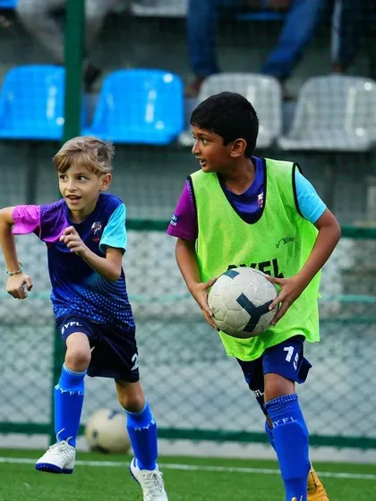 Teammates share a lighthearted moment during a training session. Building friendships is part of the BYFL experience.