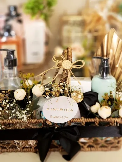 Another one of our styled baskets for Kimirica, this one featuring a dark wicker basket, black ribbon, and gold accents for a very chic and earthy look.