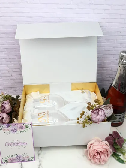 A complete view of the personalized wine glass gift set in its signature white box. It's an elegant and thoughtful gift for weddings, anniversaries, or any celebration.