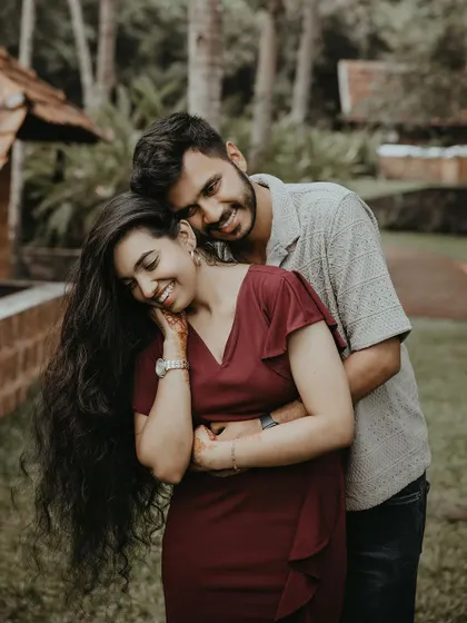 A happy and intimate embrace, capturing the couple's genuine smiles and connection.