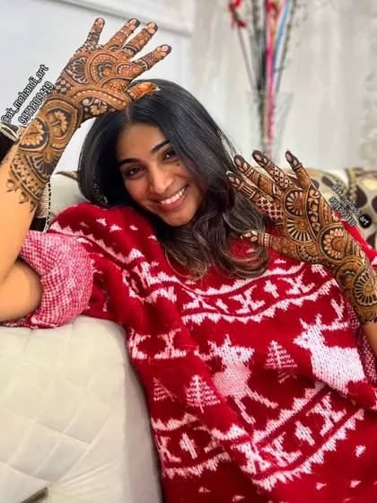 A happy client showing off her engagement mehndi. I love seeing the joy my art brings, especially for such a memorable occasion.