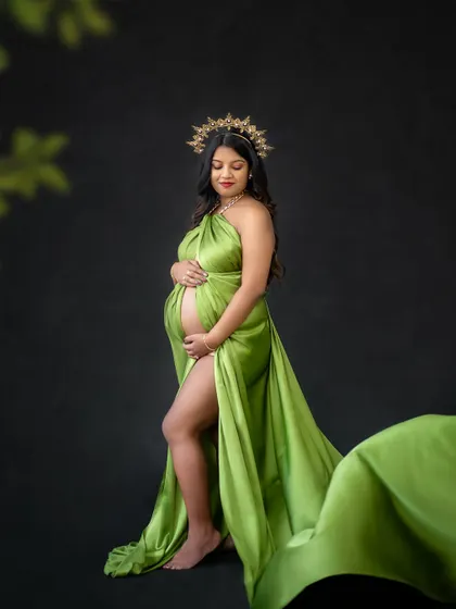 In my studio, you can be whoever you want to be. Here, we went for a regal, powerful look with a vibrant green drape and a golden crown, celebrating the queen that you are.