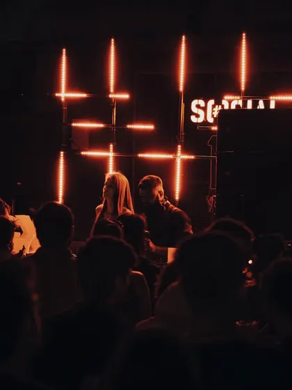 A shot from the GIGx 440Hz event, with the crowd framed by the stage and the iconic "SOCIAL" sign.