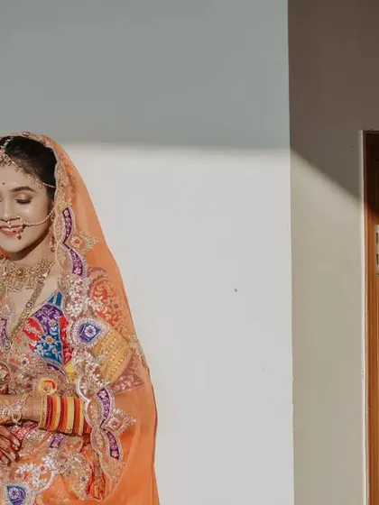 A soft and delicate portrait of the bride, capturing a moment of quiet happiness on her wedding day.