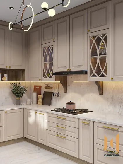 A wider view of the neoclassical kitchen, highlighting the modern circular lighting fixture that contrasts beautifully with the classic cabinetry.
